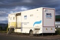 Glasgow, lanarkshire / Scotland - July 12th 2019: NHS Scottish Breast Screen Programme mobile vehicle unit parked in supermarket c