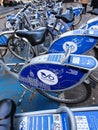 Cluster of next bikes available for hire in Glasgow showing sign and saddle Royalty Free Stock Photo