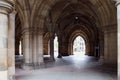 Stone gothic facade of the University of Glasgow,stone arches to the courtyard