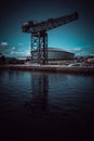 Glasgow Scotland June 2021 Glasgow finnieston crane reflection in water with blue skies on summer day