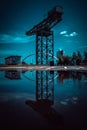 Glasgow Scotland June 2021 Glasgow finnieston crane reflection in water with blue skies on summer day