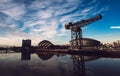 GLASGOW, SCOTLAND - JUNE 2021: the Hydro Arena and Finnieston crane reflecting on the River Clyde at Sunset on March 01, 2013 in Royalty Free Stock Photo