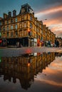 Glasgow Scotland June 2021 Sandstone tenement flats reflecting in water at sunset in Glasgow Royalty Free Stock Photo