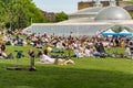 Glasgow, Scotland - May 19, 2018: View of a park in front of the botanic gardens in Glasgow, where people enjoy the late spring