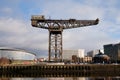 Finnieston Crane on a sunny golden hour morning. Banks of the River Clyde. Rotunda and Hydro Royalty Free Stock Photo