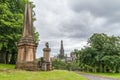 Park with tombs and Cathedral in back at Glasgow Necropolis, Scotland UK. Royalty Free Stock Photo