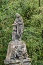 Sad woman leans on urn at Glasgow Necropolis, Scotland UK. Royalty Free Stock Photo