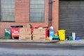 Glasgow, UK, March 26th 2023, Household plastics, cans and glass recycling containers and sign