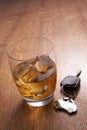 A glass of alcohol and car keys Royalty Free Stock Photo