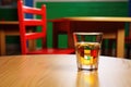 a glass of alcohol left on a childrens play table