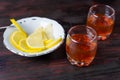 A glass of alcohol and sliced lemon. Royalty Free Stock Photo