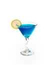 Glass of alcoholic blue drink with lemon.