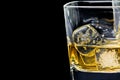 Glass of alcoholic drink on black background
