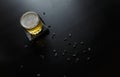 A glass of alcoholic or non-alcoholic beer standing on black wooden table with sunflower seeds around Royalty Free Stock Photo