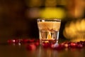 Glass with alkohol shot on wooden table Royalty Free Stock Photo