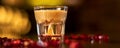 Glass with alkohol shot on wooden table Royalty Free Stock Photo