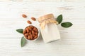 Glass of almond milk and almond seeds on white background, space for text Royalty Free Stock Photo