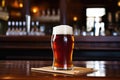 glass of amber ale in front of a toastmaster