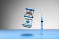 Vial of a blue VACCINE with syringe Royalty Free Stock Photo