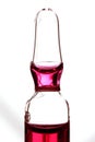 Glass ampoule with red liquid medicine Royalty Free Stock Photo