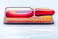 Glass ampoule red medical fluid for vaccination implantation processor chip implantation.