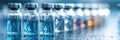 Glass Ampoules Filled With Sterile Liquid Arranged in a Neat Row Under Gradient Light in a Controlled Environment Royalty Free Stock Photo