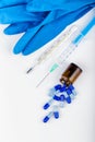 glass ampoules, medical tools and latex gloves