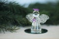 Glass angel decoration and Christmas tree branch Royalty Free Stock Photo