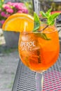 Glass of Aperol Spritz with a slice of orange and fresh mint