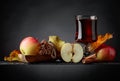 Glass of apple juice with apples and cinnamon sticks Royalty Free Stock Photo