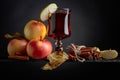 Glass of apple juice with apples and cinnamon sticks Royalty Free Stock Photo