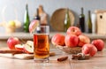 Glass of apple juice , apples and cinnamon sticks . Royalty Free Stock Photo