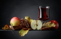 Glass of apple juice or cider with juicy apples and cinnamon sticks Royalty Free Stock Photo