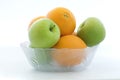 A glass apples and oranges Royalty Free Stock Photo