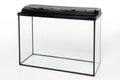 Glass aquarium with a plastic cover on a white background