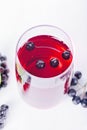 Glass of aronia juice with berries