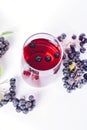 Glass of aronia juice with berries, overhead view