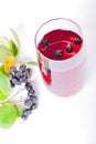 Glass of aronia juice with berries, overhead view