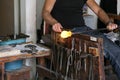 Glass Artist in her workshop making glassware Royalty Free Stock Photo