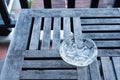 Glass Ashtray on Wooden Table.