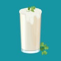 Glass of ayran with dill and parsley herbs on white.