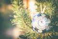 Glass ball, Christmas decoration with a clock on a Christmas tree, processing under a vintage photo, texture added, Royalty Free Stock Photo