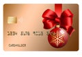 A glass ball Christmas ornament and a red ribbon and bow decorate a generic mock holiday credit card i