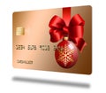 A glass ball Christmas ornament and a red ribbon and bow decorate a generic mock holiday credit card i