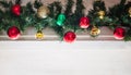 glass ball and decorations on Christmas tree.Garland with lights and red-green, gold balls on a white background Royalty Free Stock Photo