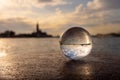 Glass ball lying on a bollard in Venice