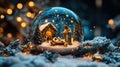 A glass ball with the nativity of Jesus inside, set against a dark blue background with falling snow, light rays Royalty Free Stock Photo