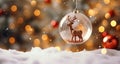 Glass ball with a reindeer inside. Beautiful Christmas tree toy. New Year and Christmas decorations. Royalty Free Stock Photo