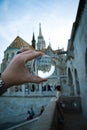 Glass ball with an upside-down reflection of Fisherman's Bastion in Budapest, Hungary