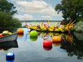 Glass Balls and Swirls in a Boat in a Pond Overlooking White Rock Lake with Sky Reflection in Dallas, Texas